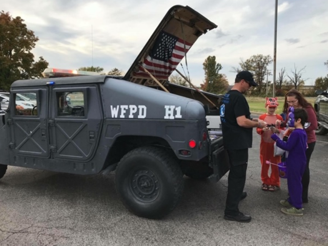 WFPD H1 car handing out candy to trunk or treaters